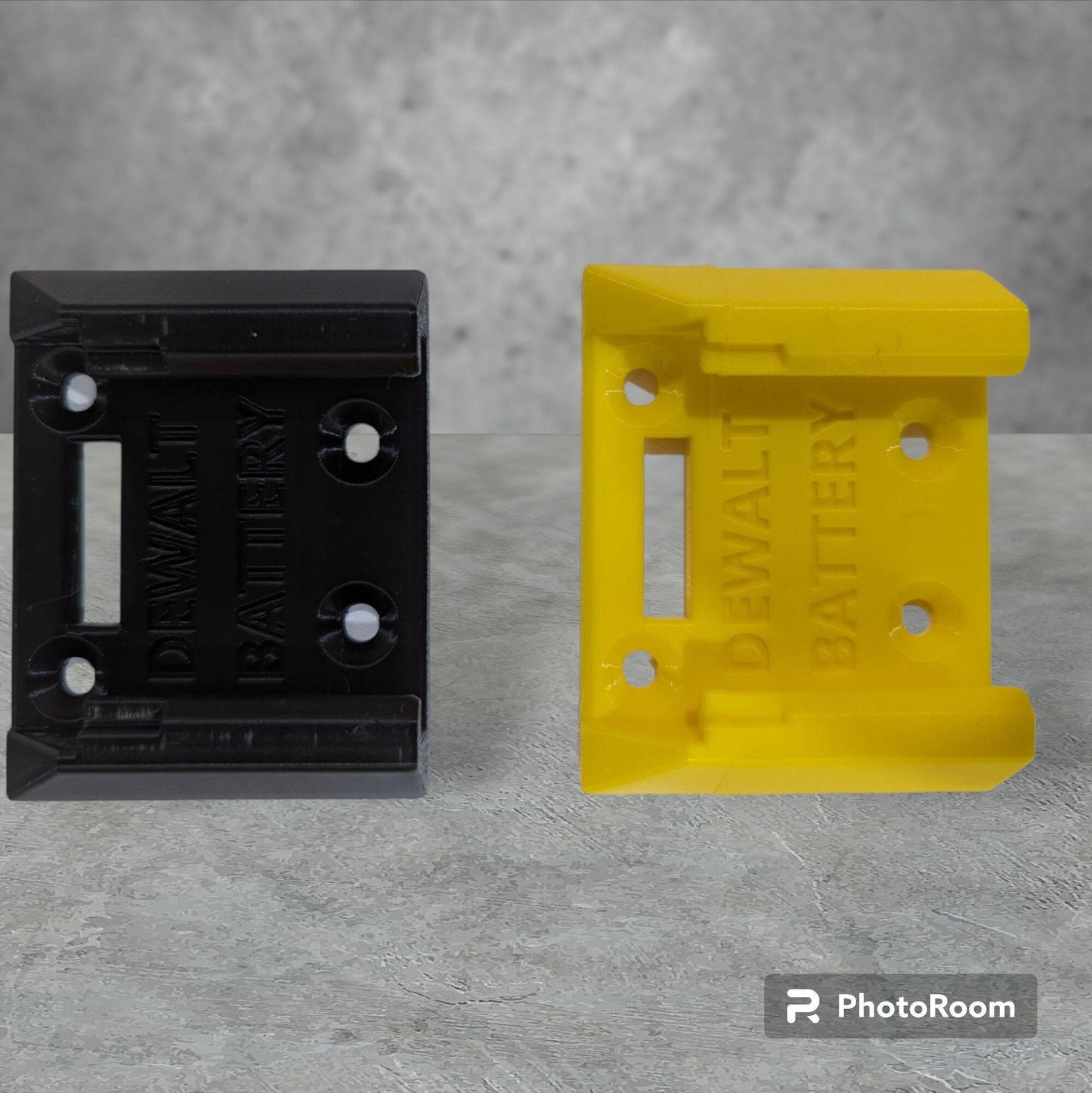 a couple of yellow and black dewalt 20v battery mounts