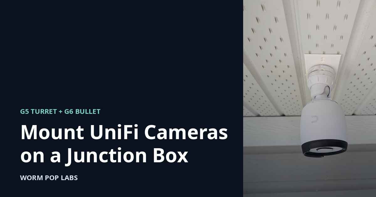 UniFi G6 Bullet camera mounted under a vinyl soffit on a white junction box adapter plate