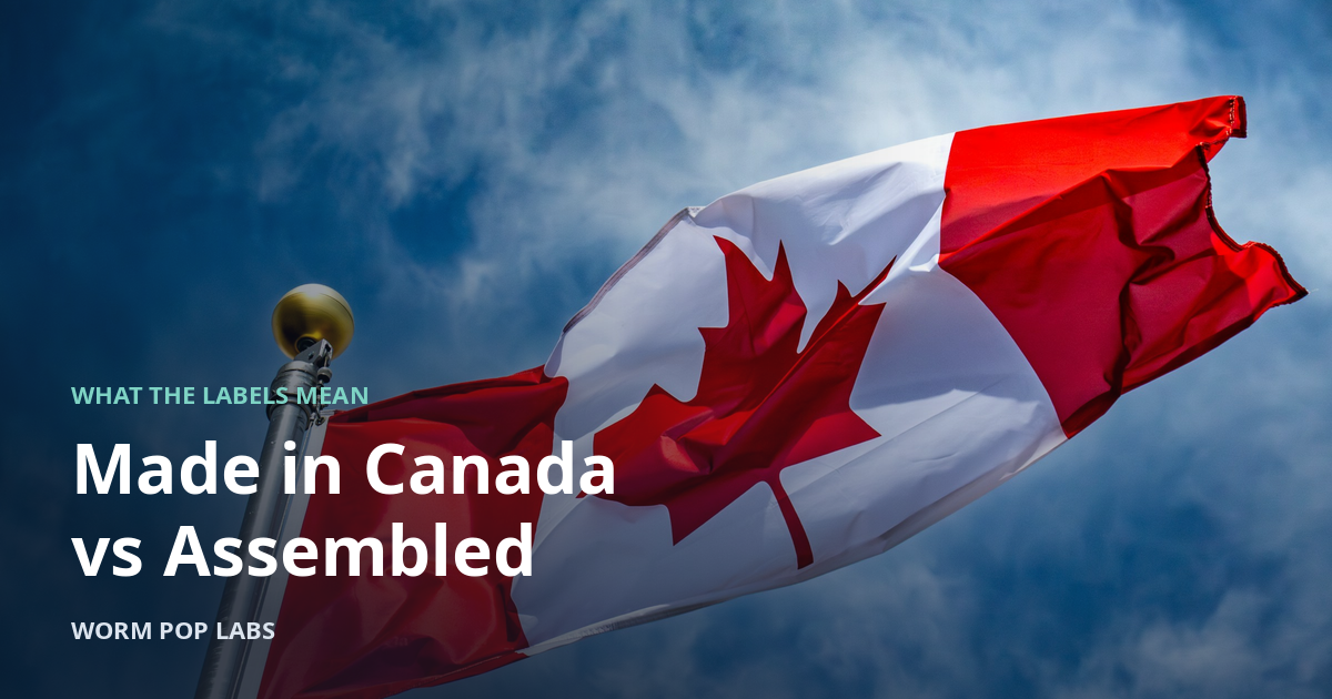 Canadian flag waving against a blue sky.