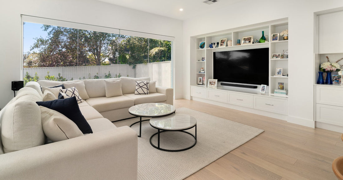 Living room with flat screen television and framed art for a Samsung The Frame image sizing guide