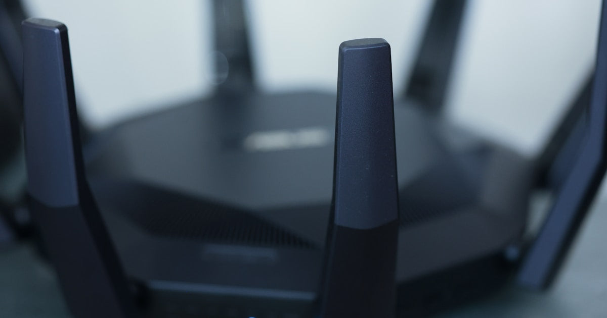 Close-up of WiFi router antennas broadcasting wireless signals on 2.4 GHz channels