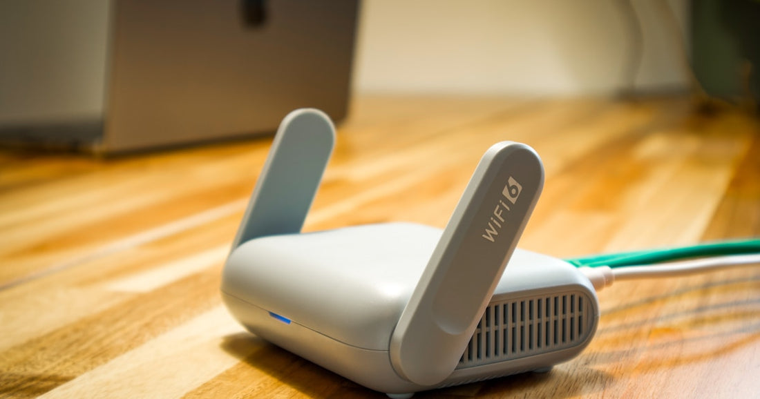 WiFi router on a wooden desk with ethernet connections for home network configuration