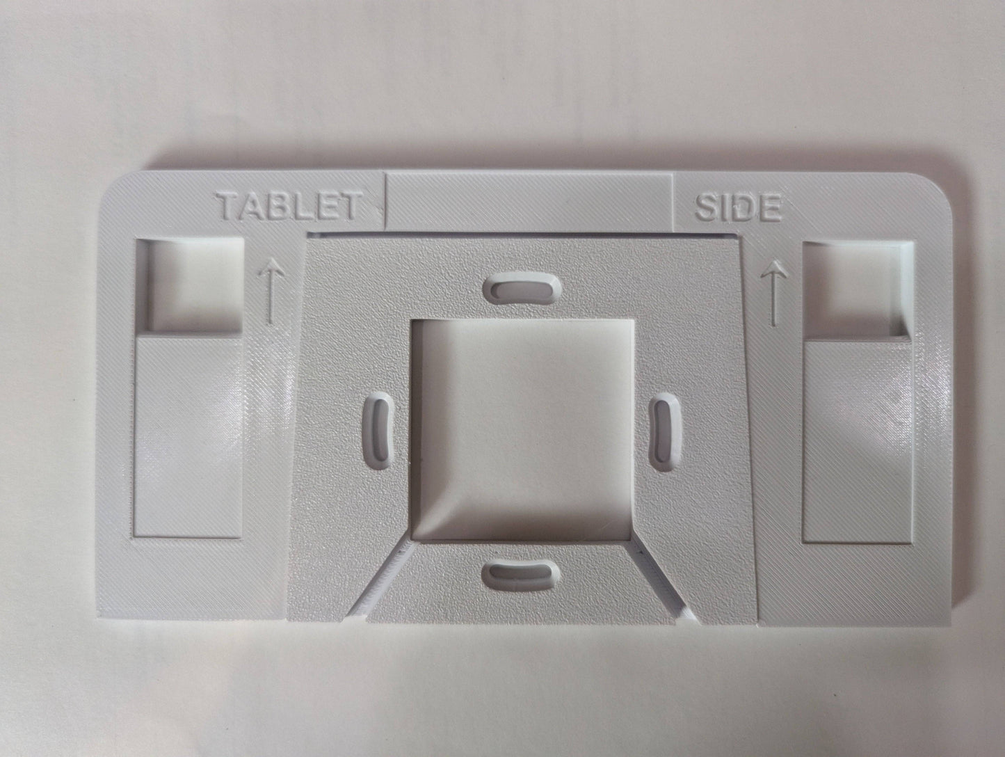 a close up of a white electrical outlet