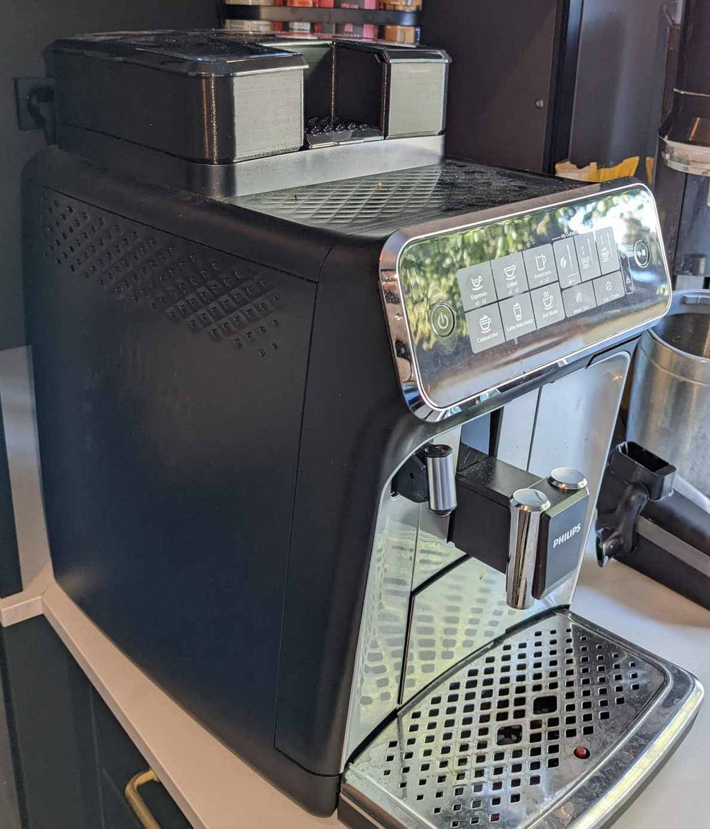 Coffee beans in a grinder’s hopper ready for brewing