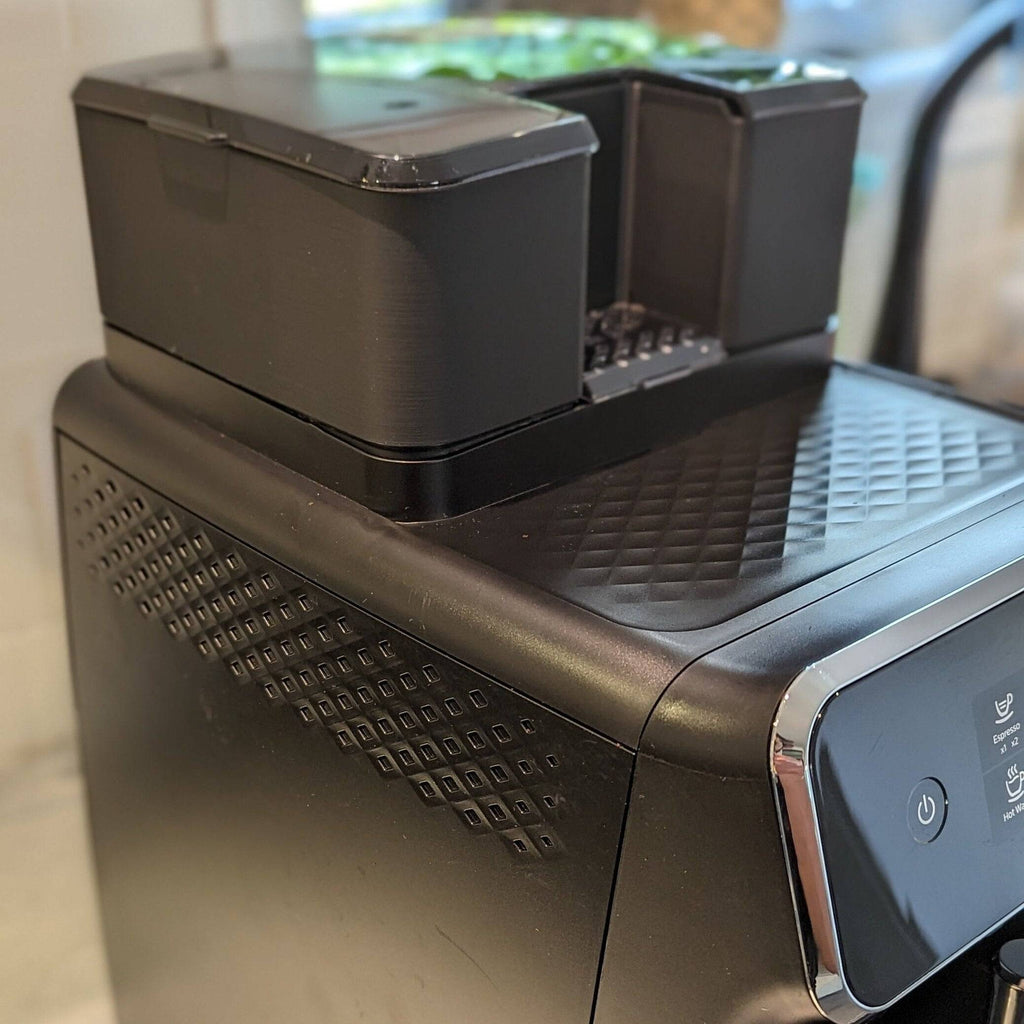 Freshly roasted coffee beans in a grinder hopper