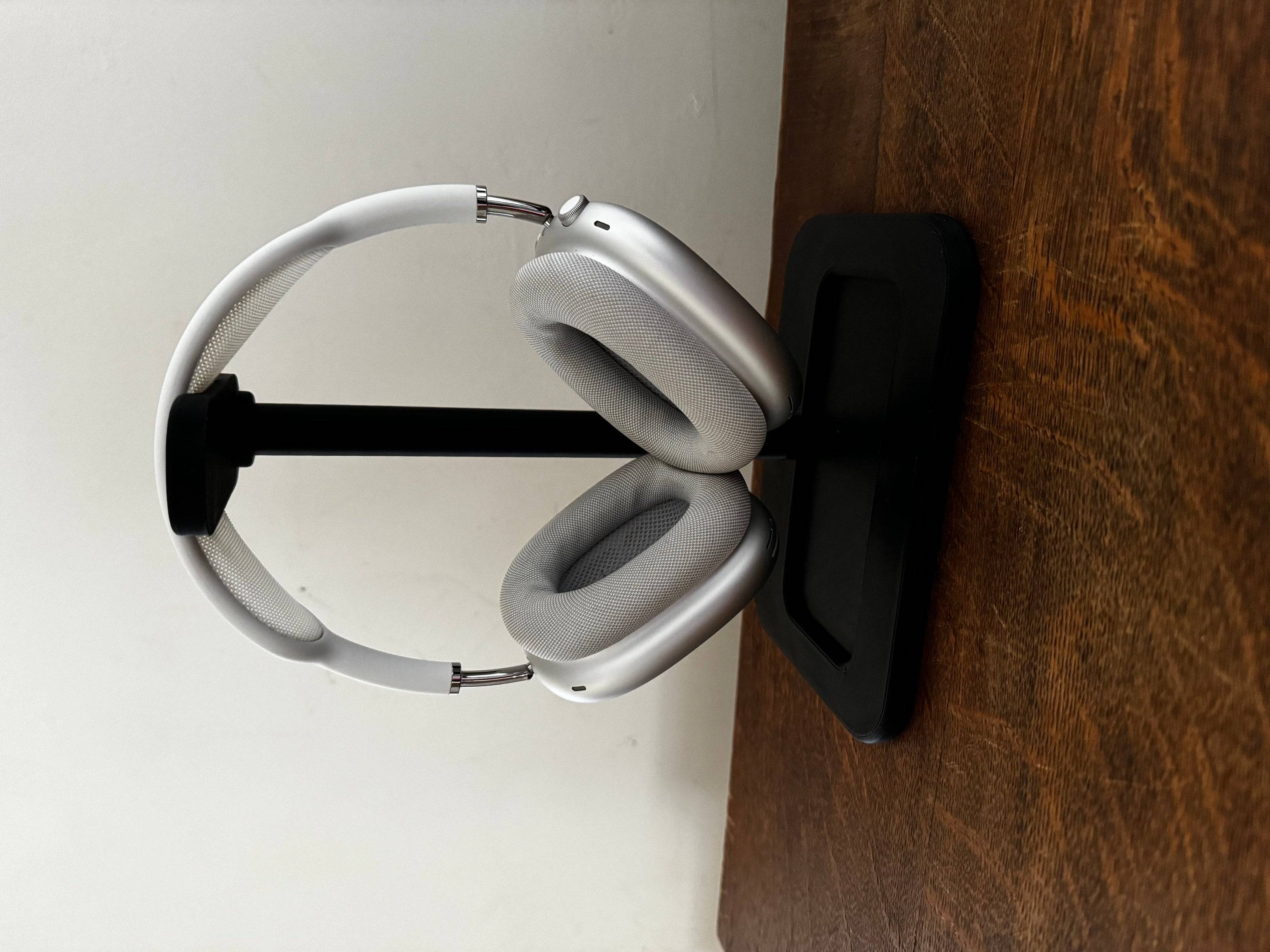 apple airpod max headphones on a display stand