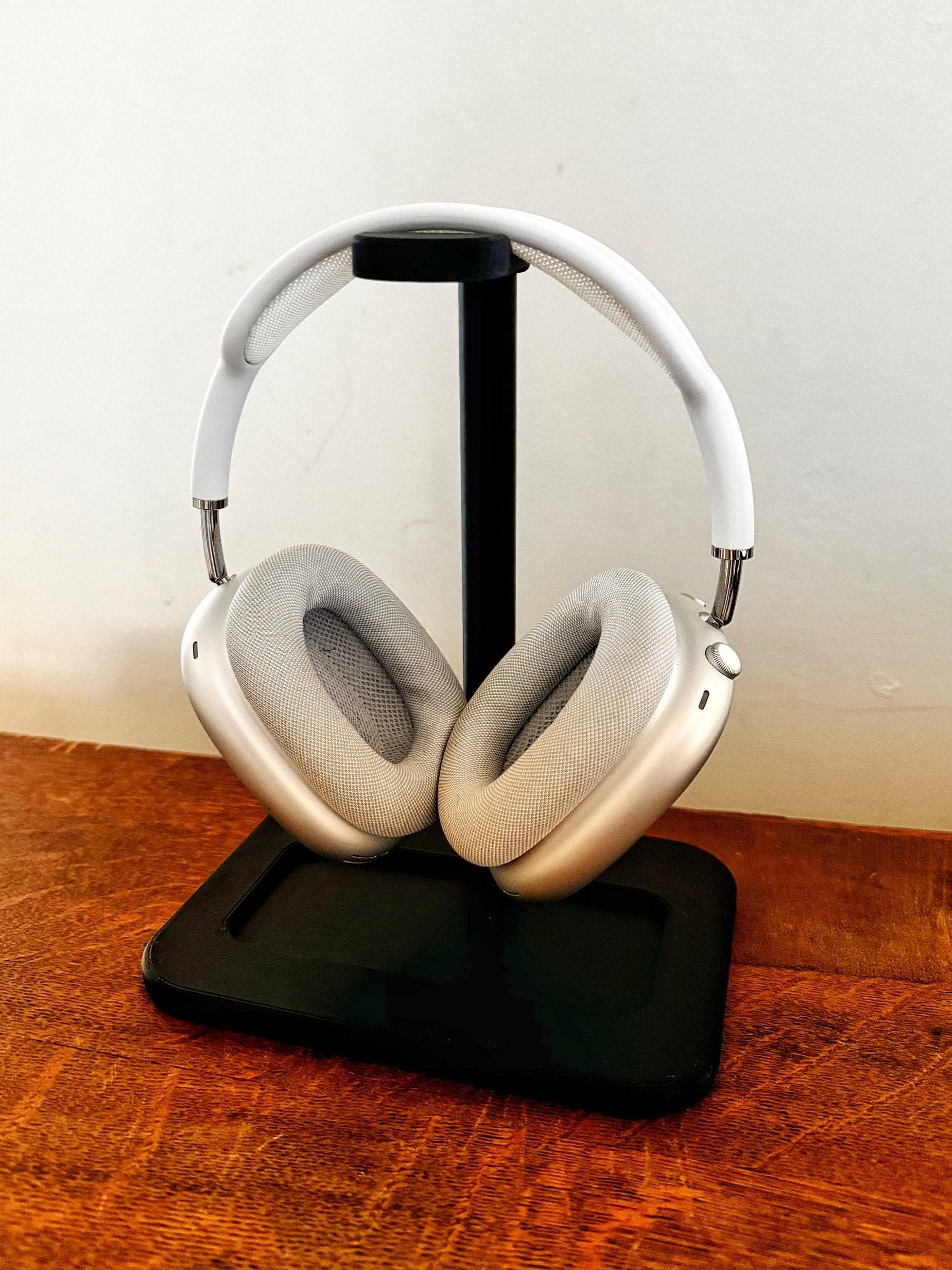 apple airpod max headphones on a display stand